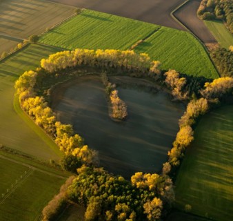 Aerial view of a lake in the shape of a heart north of Luenen