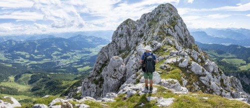 Mountaineer on a narrow ridge path