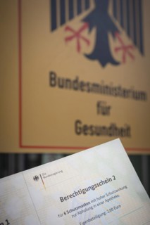 Certificate of entitlement for six FFP2 high protection masks to be collected from a pharmacy. Recorded in front of the Federal Ministry of Health in Berlin