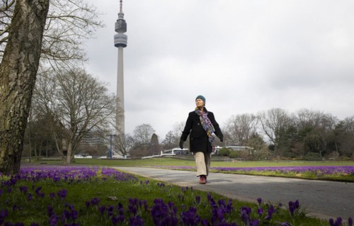 Subject: Woman walking. Woman walking in the Westfalenpark in Dortmund