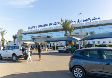 Cars parked outside airport terminal building