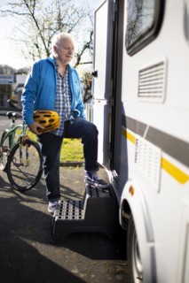 Subject: Pensioner goes into his caravan.