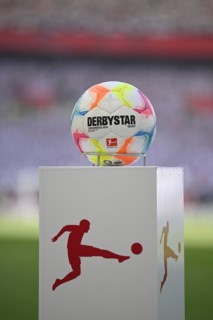 Adidas Derbystar match ball on pedestal in front of the start of a Bundesliga match