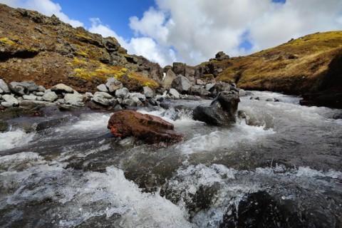 Fast-flowing river at Raudholl crater