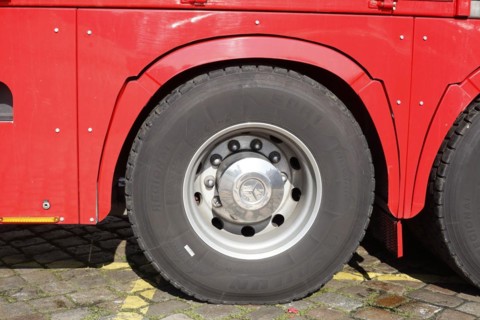 Wheel and tyre on a red Mercedes truck