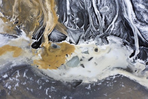 Aerial view over the glacial Virkisa River basin along the Glacier Falljoekull in winter in Austurland