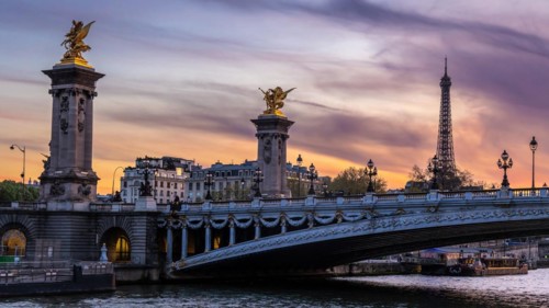 Evening atmosphere in the Seine in Paris with Pont Alexandre III bridge and Eiffel Tower