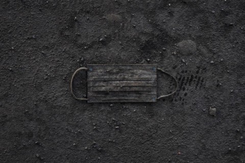 A discarded mouth-nose protection lies filthy on the ground in Berlin
