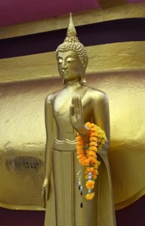 Standing Buddha figure with blessing hand posture
