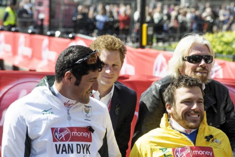 Prince Harry presents a medal to the Mens Elite Wheelchair winner Kurt Fearnley at the Virgin London Marathon Medal Presentations on 21.04.2013 at The Mall