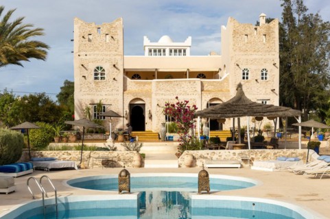 Out of Medina riad hotel swimming pool and building