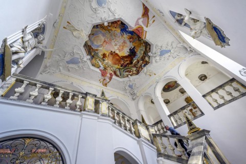 Staircase house with figures and ceiling fresco