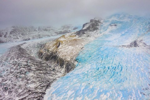 Aerial view in winter over the glacier Falljoekull