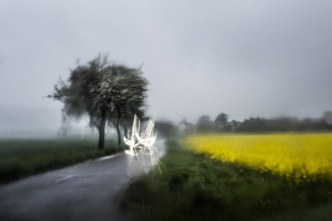 A car stands out through a wet window in Vierkirchen