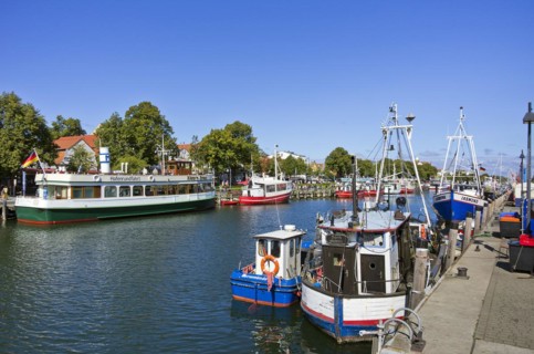 Fishing boats and excursion ships at the Alter Strom in Rostock-Warnemuende