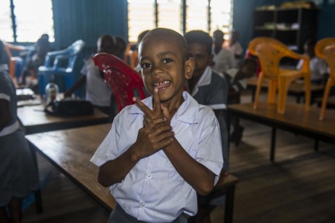 Very happy school children in a school