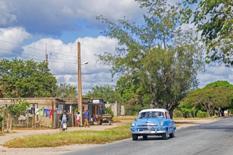Vintage American classic car driving on the Carretera Central