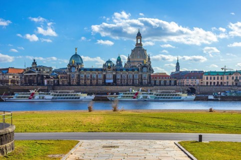 The historic old town scenery on the Terrassenufer seen from the Koenigsufer with a view of the steamer landing stage with paddle steamers