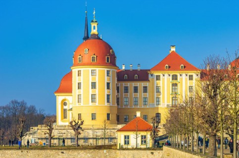 Exterior view of Moritzburg Castle in winter with half-frozen castle pond from the south