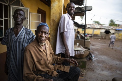 Three men in Bomeh Village at the KissyRoad dumpsite