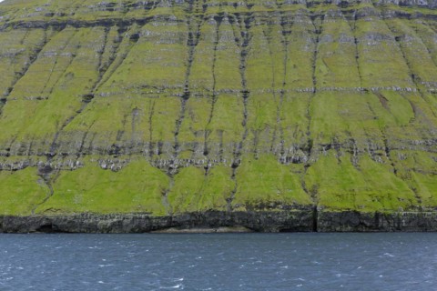 Sea cliffs along the rugged coast of Eysturoy