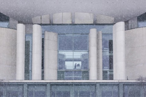 A person with files stands out in the Federal Chancellery in front of the Federal-Laender on the further procedure of the Corona restrictions
