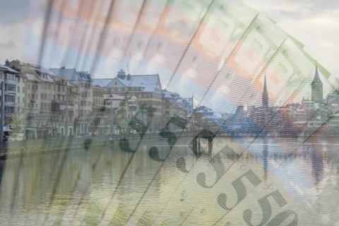 Zurich with the river and Swiss franc banknotes