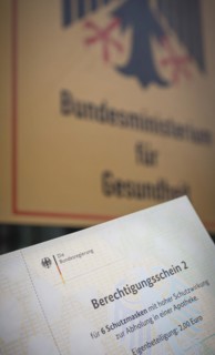 Certificate of entitlement for six FFP2 high protection masks to be collected from a pharmacy. Recorded in front of the Federal Ministry of Health in Berlin