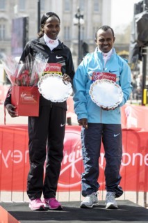 Elite mens and womens winners Tsegaye Kebede and Priscah Jeptoo at the Virgin London Marathon Medal Presentations on 21.04.2013 at The Mall
