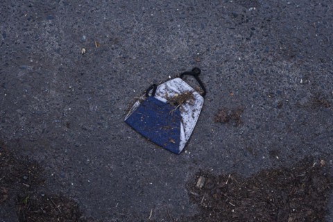 A discarded mouth-nose protection lies on the ground