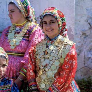 Girls decorated with gold coins