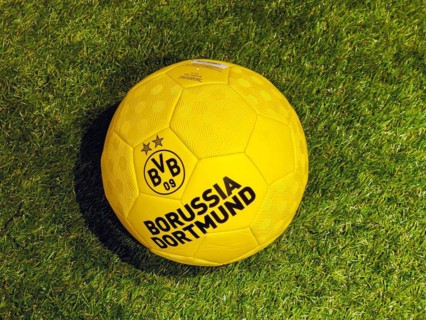 Yellow black football as fan article in a BVB fan shop by Borussia Dortmund