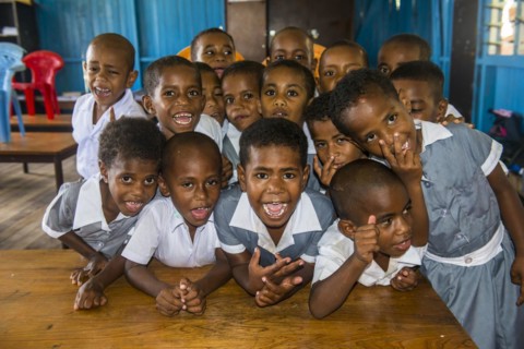 Very happy school children in a school