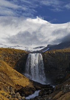 The Snaefellsjoekull with the Svoedufoss waterfall
