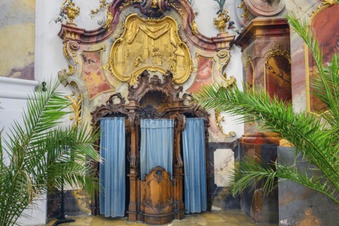 Richly carved confessional