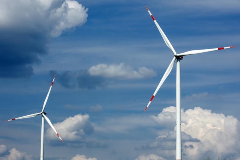 Two wind turbines in summer towering into the sky in Brandenburg near Luckau