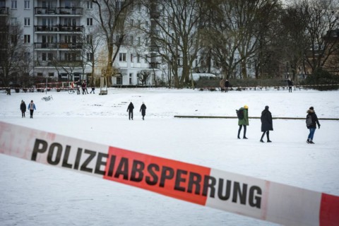 People walk on the frozen Landwehrkanal in Berlin. 11.02.2021.