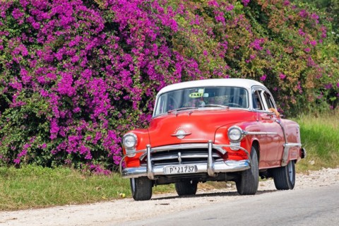 Red 1950s Oldsmobile 88 American classic car used as Cuban taxi