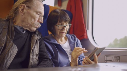 Elderly couple travel by train