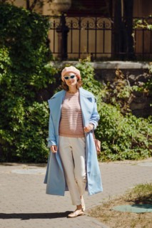 Stylish woman in blue trench coat