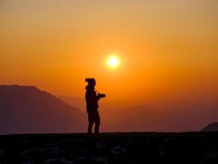 Silhouette of a photographer at sunset