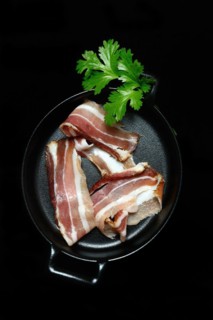 Bacon strips in pans