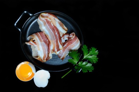 Bacon strips in patties and beaten egg