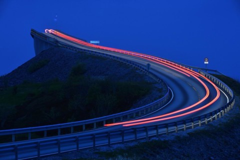Car taillight on the Storseisund Bridge on the Atlantic Road