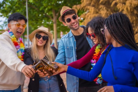 Group of multi ethnic friends partying in a park