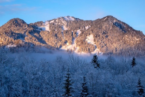 Sun shines on the wintry mountain Brauneck