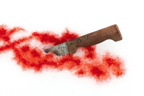 Knife and traces of blood on the snow