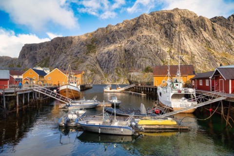 Historic buildings and fishing boats in Nusfjord harbour