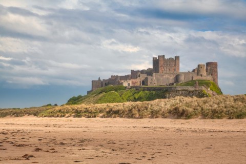 Flat sandy coast with Bamburgh Castle