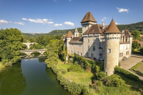 The castle of Cleron and the river Loue seen from the air
